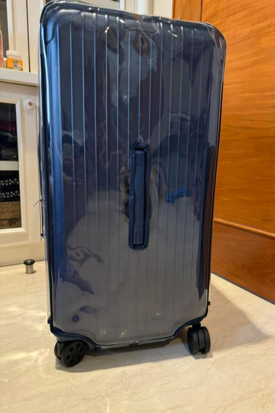 Customer photo of a clear cover with navy trim for a Rimowa Essential Trunk Plus