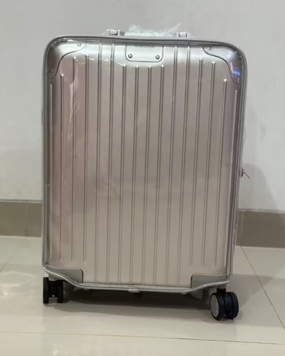 New Rimowa suitcase protected with a clear custom-fit TPU cover from day one — by Fixmeuniva