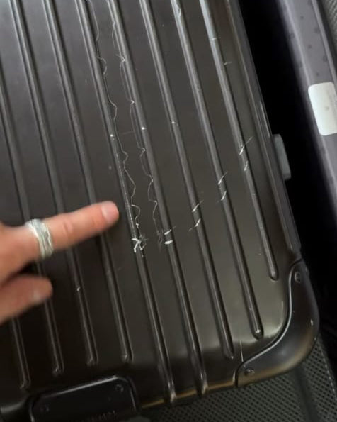 Rimowa suitcase first scratch from airport conveyor belt — why protection before the first trip matters, by Fixmeuniva
