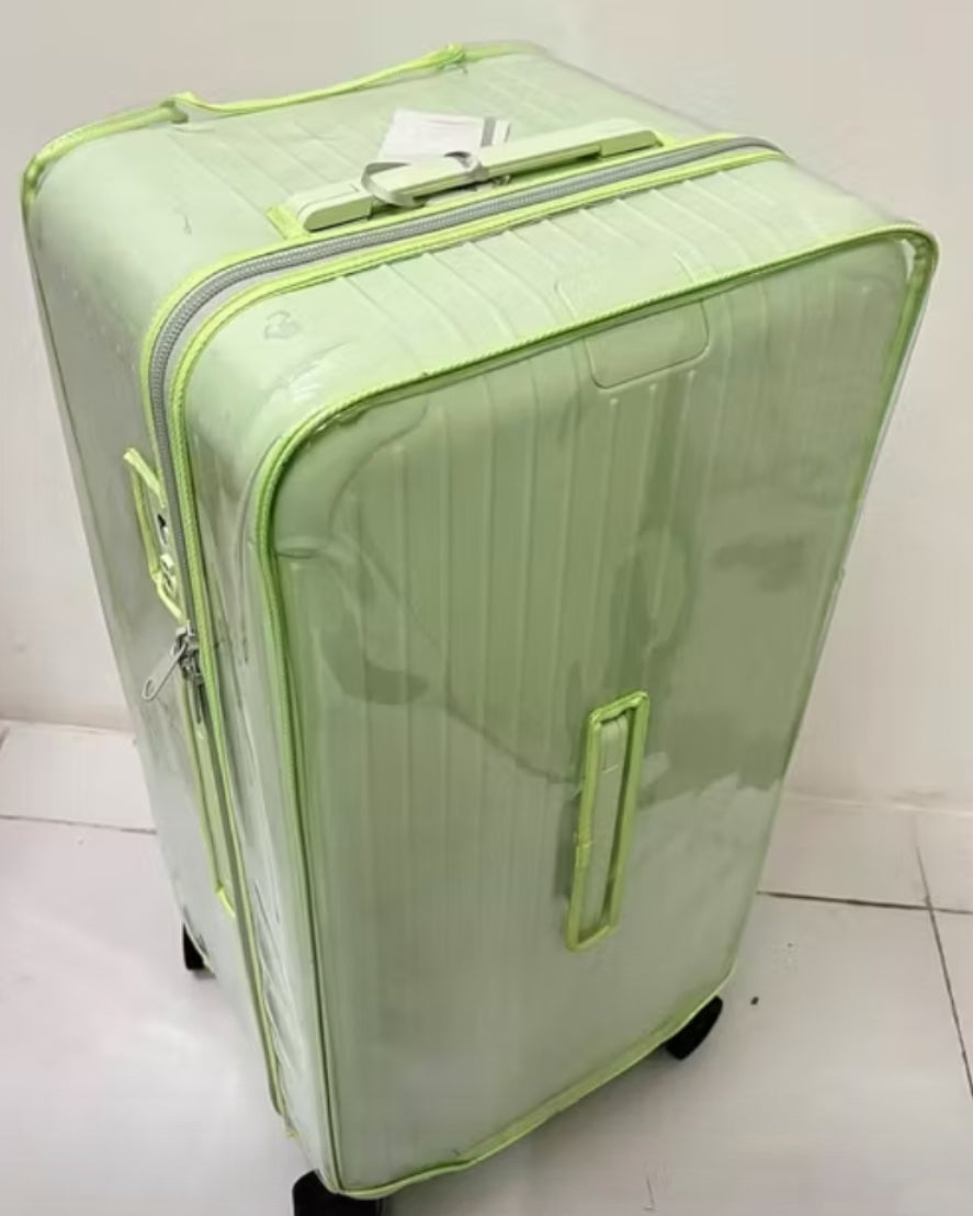 Rimowa suitcase fitted with a clear Fixmeuniva cover with light green trim, showing the top zipper and side handle.
