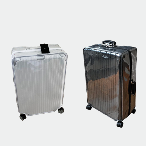 Rimowa Hybrid Check-In M on the left and Classic Check-In M on the right, both fitted with Fixmeuniva clear luggage covers.