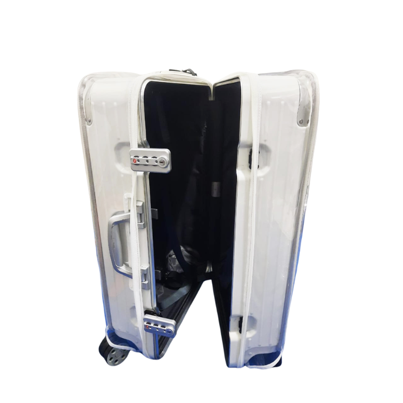 Rimowa Hybrid Check-In M opened with the clear Fixmeuniva cover still fitted to both suitcase halves.